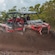 Guests in helmets riding an Xrail 4 by 4 vehicle through a muddy trail in Cozumel, Mexico